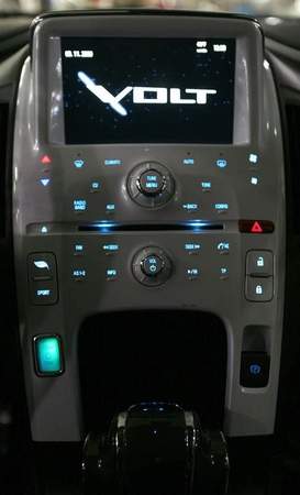  a spinning, three-dimensional "Volt" logo on a touch-screen panel, 